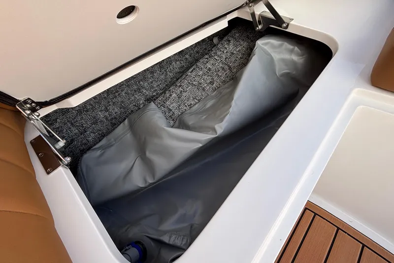 Slide: The Image of Storage compartment in 2026 MB SPORTS F21 Classic boat, featuring gray interior lining. - 35