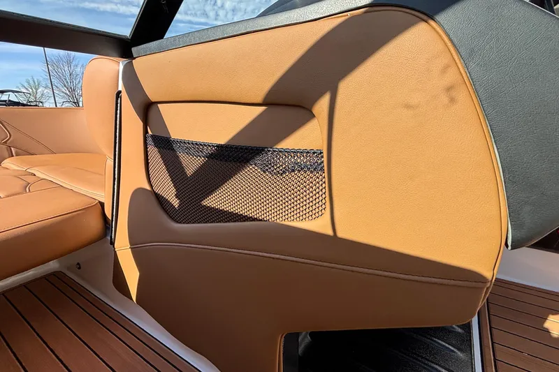 Slide: The Image of 2026 MB SPORTS F21 Classic interior with tan leather seating and mesh pocket detail. - 39