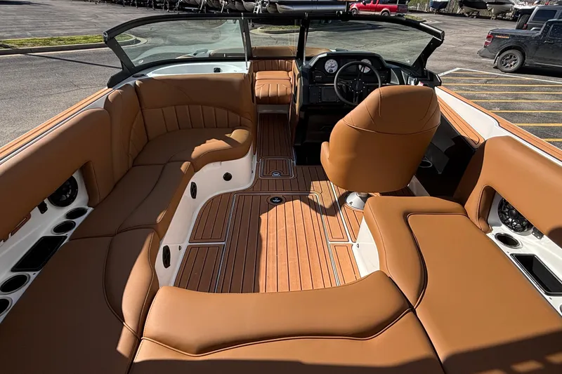 Slide: The Image of 2026 MB SPORTS F21 Classic boat interior with tan leather seating and wood accents. - 5