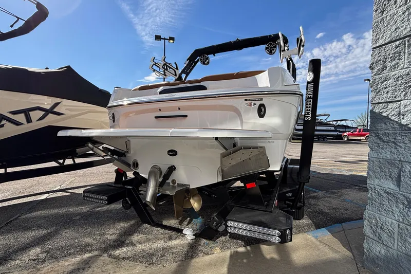 Slide: The Image of 2026 MB SPORTS F21 Classic boat rear view in a parking lot. - 56