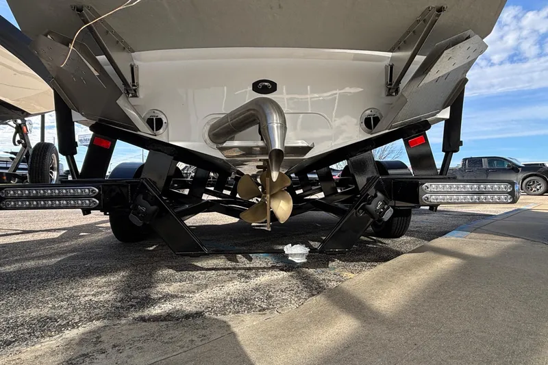 Slide: The Image of 2026 MB SPORTS F21 Classic boat rear view with propeller and trailer. - 58