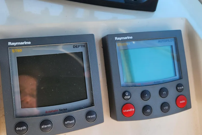 Slide: The Image of Raymarine ST60 depth and autopilot displays on 2003 Mainship Pilot 30-II boat. - 14