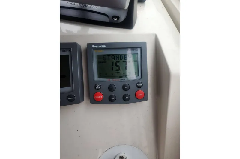 Slide: The Image of Raymarine autopilot display on 2003 Mainship Pilot 30-II boat dashboard. - 22