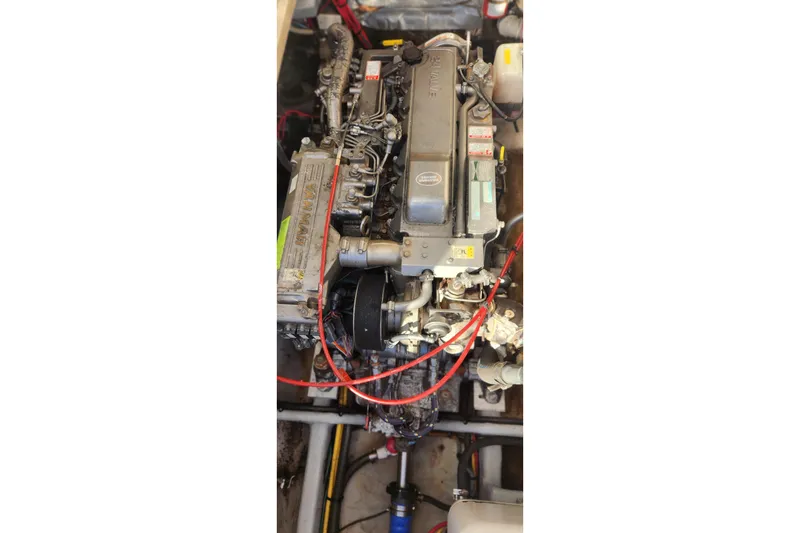 Slide: The Image of Engine of a 2003 Mainship Pilot 30-II boat, featuring Yanmar components. - 23