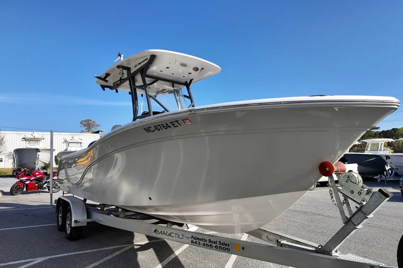 Slide: The Image of 2021 Sea Fox 248 Commander boat on trailer under clear blue sky. - 1