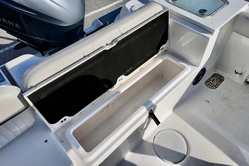 Slide: The Image of Open storage compartment on a 2021 Sea Fox 248 Commander boat, featuring a Yamaha engine. - 13
