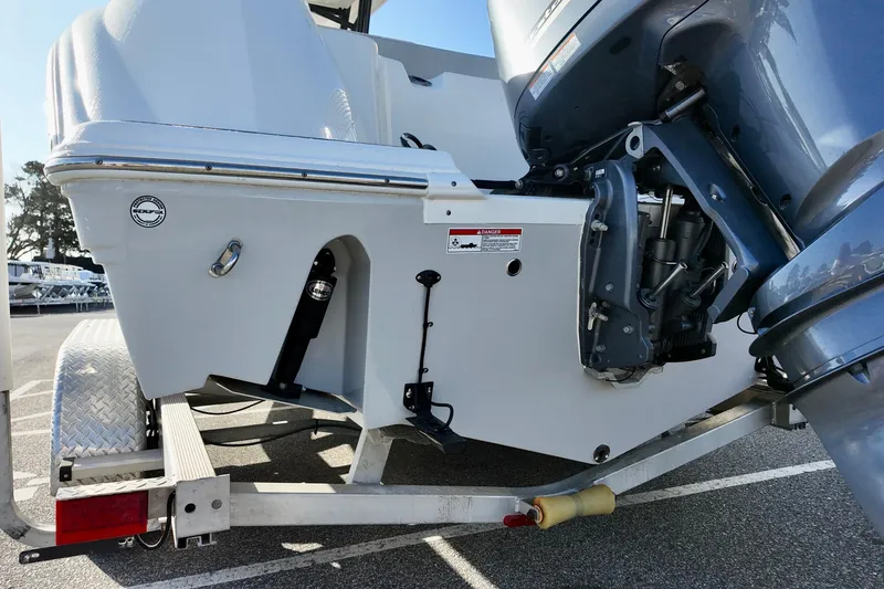 Slide: The Image of 2021 Sea Fox 248 Commander boat on trailer, showcasing engine and hull details. - 2