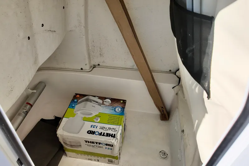 Slide: The Image of Storage compartment of 2021 Sea Fox 248 Commander with Thetford Porta Potti box. - 7