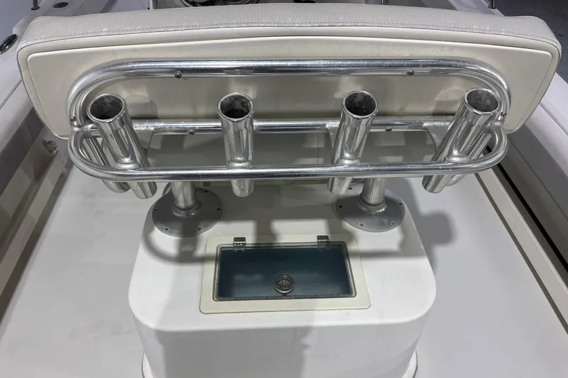 Slide: The Image of Parker 2100 Center Console 2020 boat with rod holders and storage compartment. - 19