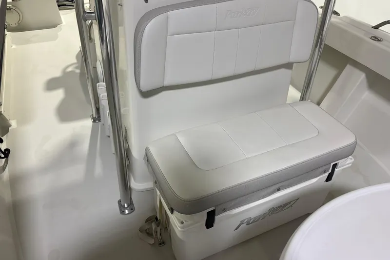 Slide: The Image of 2020 Parker 2100 Center Console boat interior with cushioned seating and storage. - 22