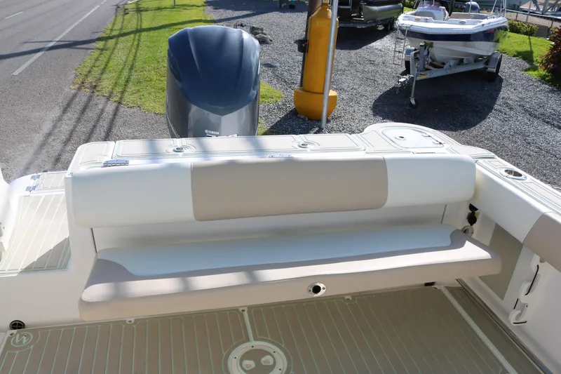 Slide: The Image of 2019 Robalo R247 Dual Console boat with Yamaha outboard engine and cushioned seating. - 14