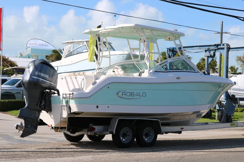 Slide: The Image of 2019 Robalo R247 Dual Console boat on trailer with Yamaha engine. - 4