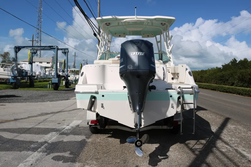 Slide: The Image of 2019 Robalo R247 Dual Console boat with Yamaha 300 engine, parked outdoors. - 5