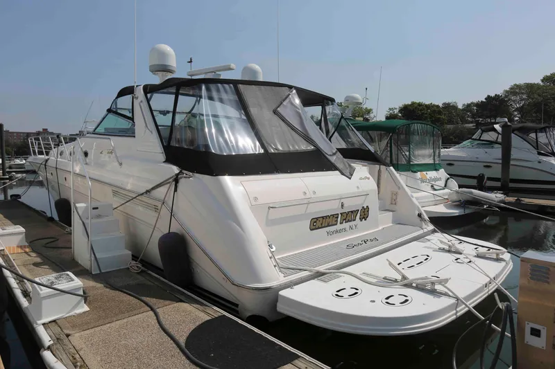 Slide: The Image of 1999 Sea Ray 500 Sundancer yacht docked at marina, rear view. - 2