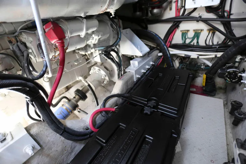 Slide: The Image of Engine room of 1999 Sea Ray 500 Sundancer with visible wiring and components. - 23