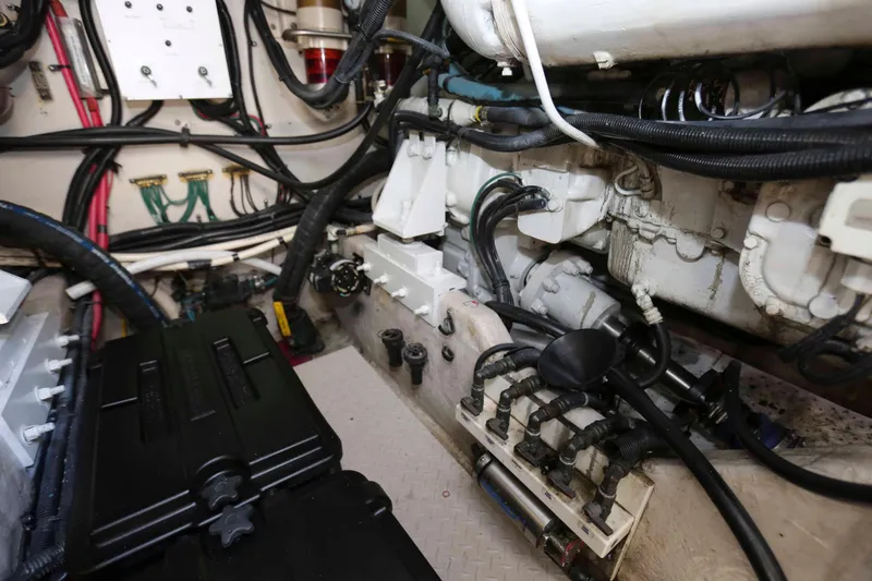 Slide: The Image of Engine room of a 1999 Sea Ray 500 Sundancer with visible wiring and components. - 24