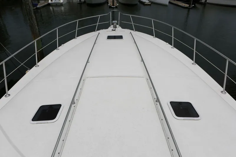Slide: The Image of Deck view of 1999 Sea Ray 500 Sundancer yacht in marina. - 5