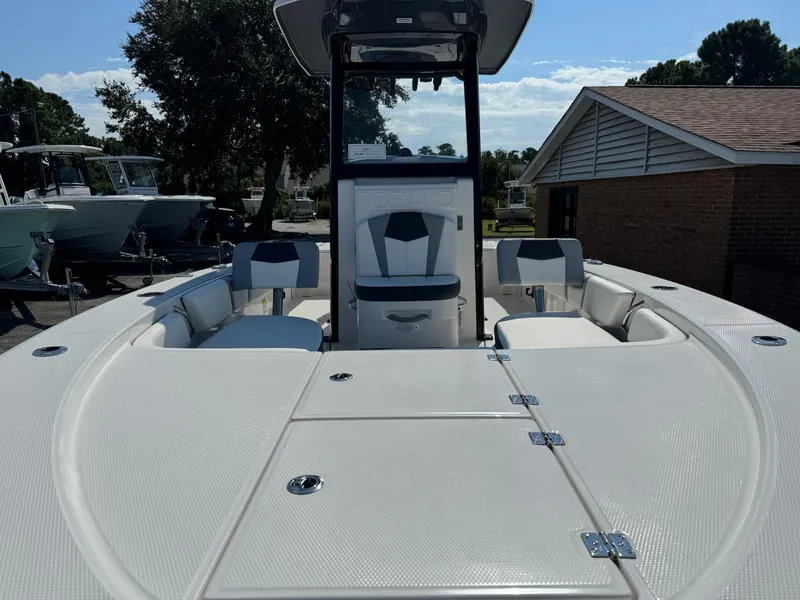 Slide: The Image of 2025 Robalo R246 CAYMAN boat interior with seating and storage compartments. - 3