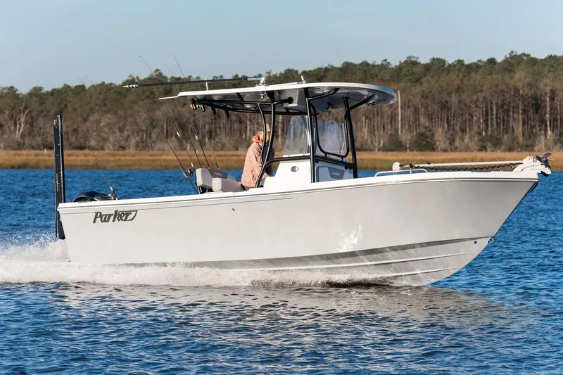The Image of Manufacturer Provided Image: 2026 Parker 230 Coastal Elite boat cruising on a serene lake. - 0