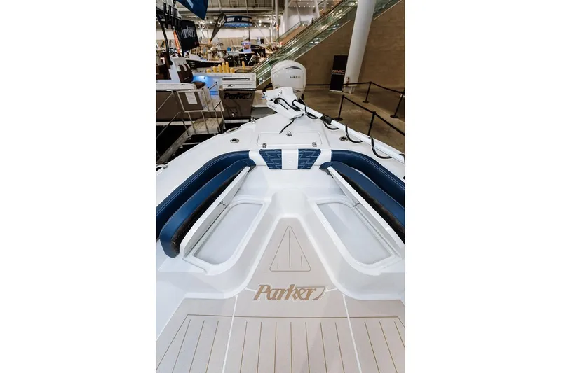 Slide: The Image of Manufacturer Provided Image: 2026 Parker 230 Coastal Elite boat interior with blue seating and modern design. - 3