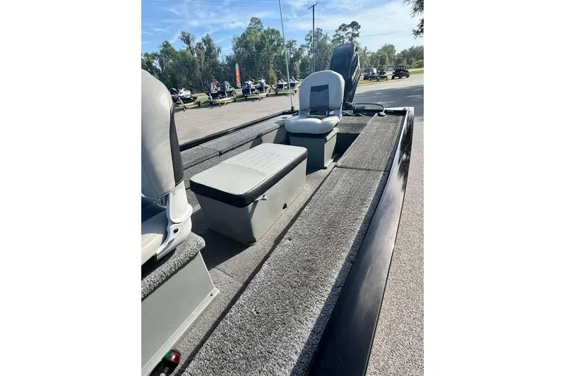 Slide: The Image of 2018 Tracker Panfish 16 boat interior with seating and carpeted deck. - 10