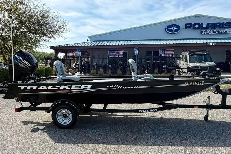 Slide: The Image of 2018 Tracker Panfish 16 boat on trailer outside dealership. - 4