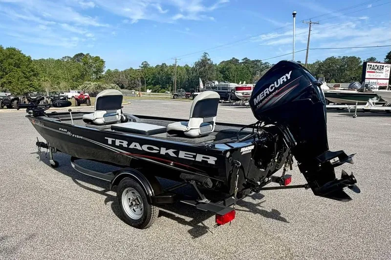 Slide: The Image of 2018 Tracker Panfish 16 boat with Mercury outboard motor in a parking lot. - 7