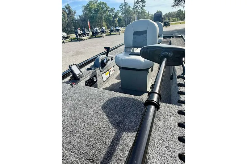 Slide: The Image of 2018 Tracker Panfish 16 boat interior with seating and control panel. - 9