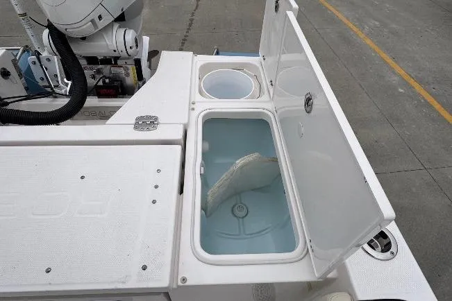 Slide: The Image of Livewell compartments on a 2026 Robalo 266 Cayman boat, open and ready for use. - 18