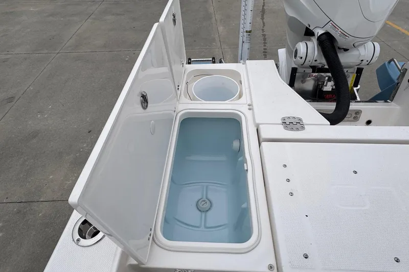 Slide: The Image of Livewell and storage compartments on 2026 Robalo 266 Cayman boat deck. - 22