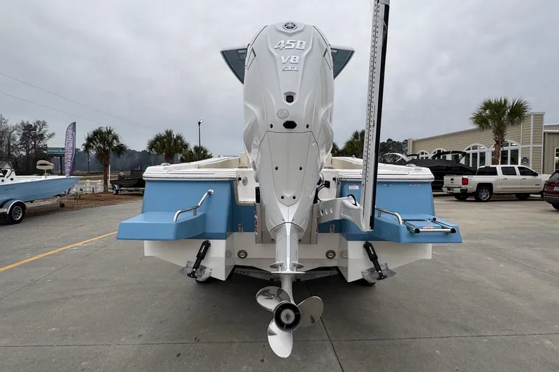 Slide: The Image of 2026 Robalo 266 Cayman boat with powerful 450 V8 engine, displayed outdoors. - 3