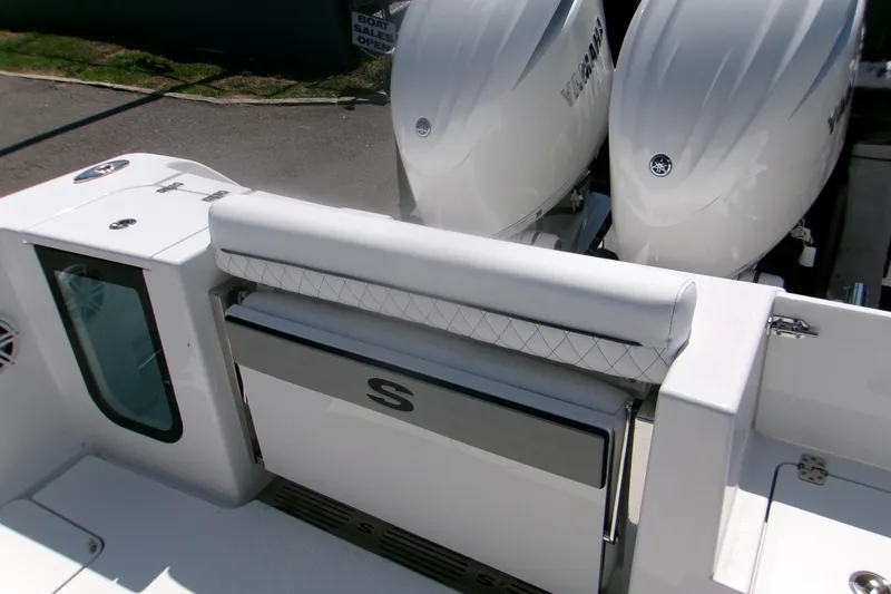 Slide: The Image of 2026 Sportsman Open 252 Center Console boat with dual engines and sleek seating. - 10