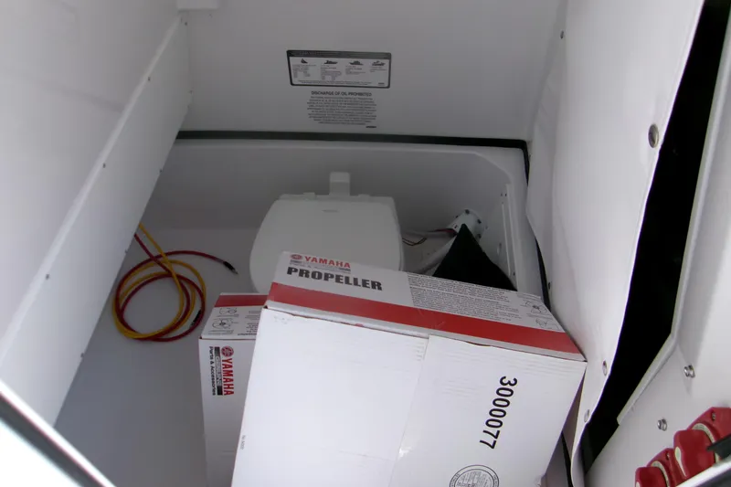 Slide: The Image of Storage compartment of 2026 Sportsman Open 252 Center Console with Yamaha propeller box. - 14