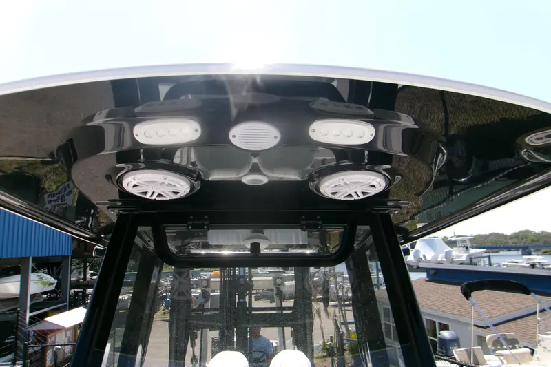 Slide: The Image of 2026 Sportsman Open 252 Center Console boat with advanced lighting and speaker system. - 16