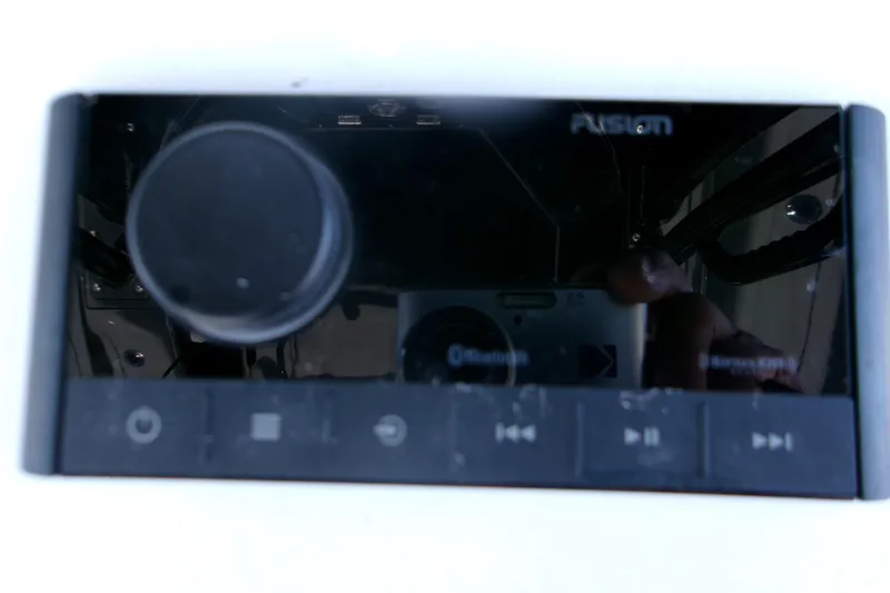 Slide: The Image of Fusion marine audio system on a 2026 Sportsman Open 252 Center Console boat. - 19