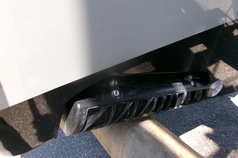 Slide: The Image of Close-up of 2026 Sportsman Open 252 Center Console boat hull detail. - 6