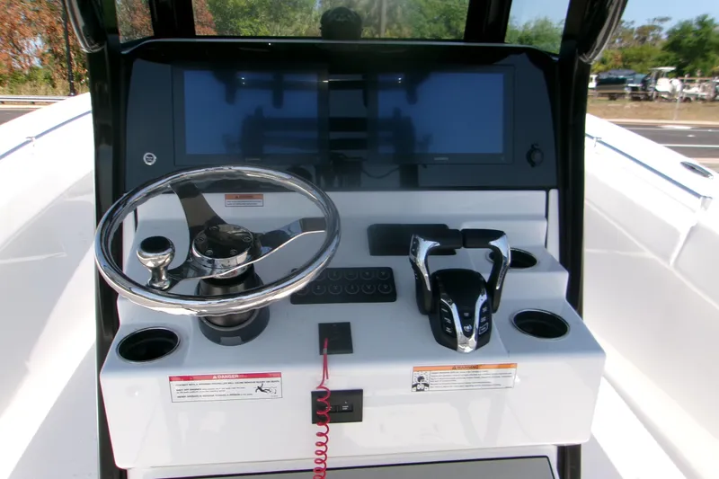 Slide: The Image of 2026 Sportsman Open 252 Center Console dashboard with steering wheel and controls. - 7