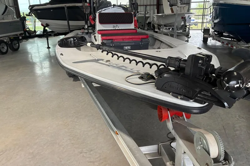 Slide: The Image of 2018 Majek 22 Xtreme boat on trailer in indoor storage facility. - 2