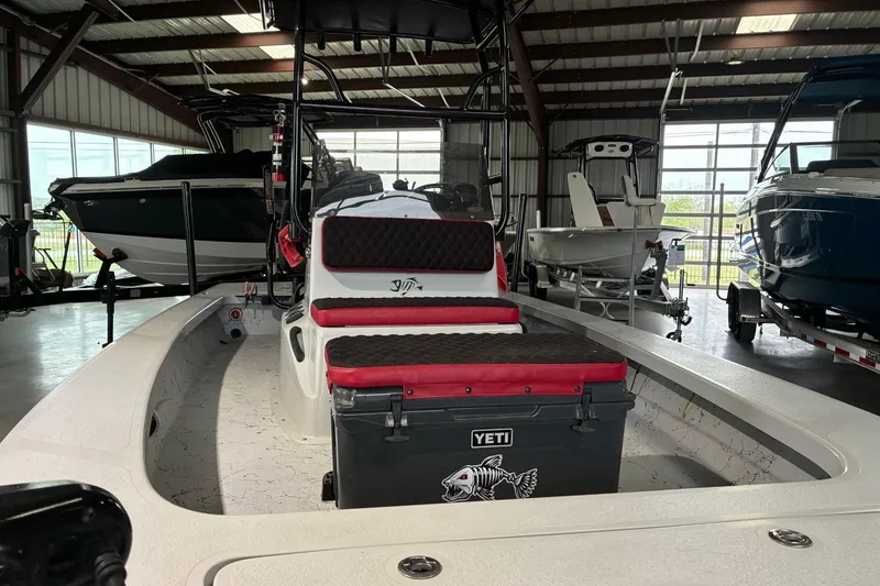 Slide: The Image of 2018 Majek 22 Xtreme boat in a showroom with Yeti cooler. - 3