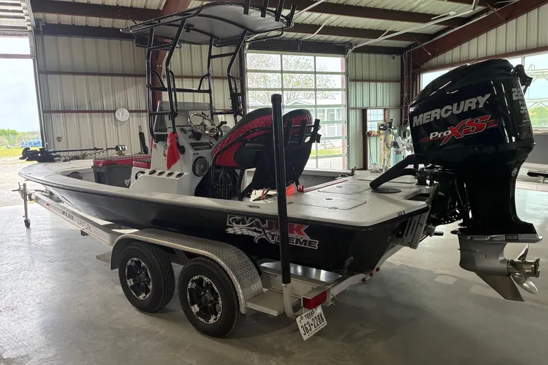 Slide: The Image of 2018 Majek 22 Xtreme boat with Mercury Pro XS engine in a garage. - 4