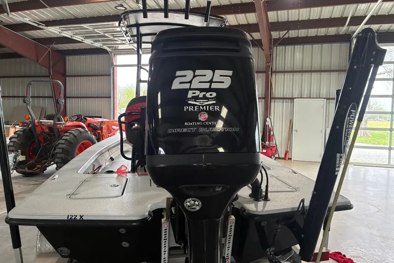 Slide: The Image of 2018 Majek 22 Xtreme boat with 225 Pro engine in a garage setting. - 5