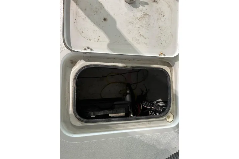 Slide: The Image of Open hatch on 2018 Majek 22 Xtreme boat showing internal wiring and components. - 6
