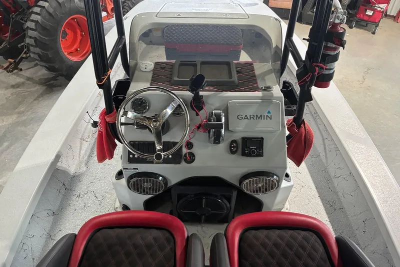 Slide: The Image of 2018 Majek 22 Xtreme boat console with Garmin navigation system and red-accented seating. - 9