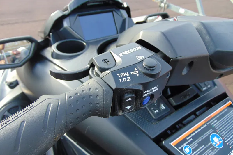 Slide: The Image of 2023 Yamaha WaveRunner FX SVHO handlebar controls with trim and cruise features. - 12