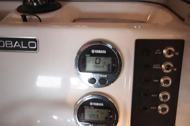 Slide: The Image of 2016 Robalo R200 Center Console dashboard with Yamaha gauges and control switches. - 11