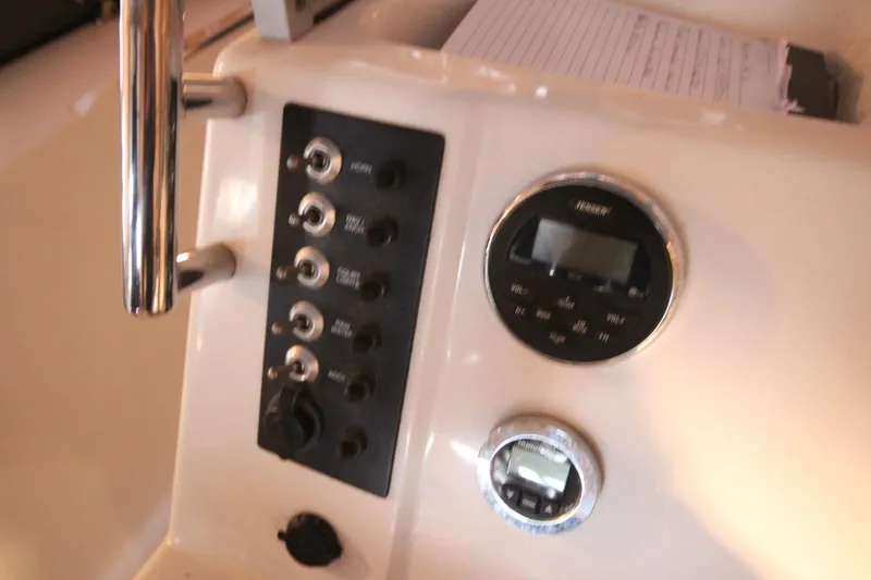 Slide: The Image of 2016 Robalo R200 Center Console dashboard with control panel and gauges. - 12