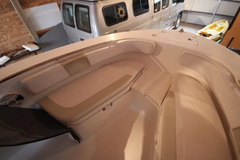 Slide: The Image of 2016 Robalo R200 Center Console boat interior with seating and storage. - 14