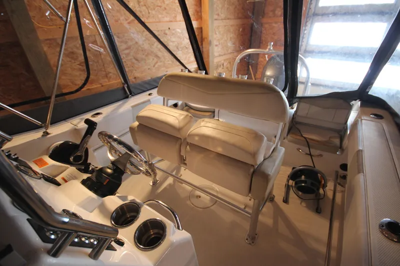 Slide: The Image of 2016 Robalo R200 Center Console boat interior with steering wheel and seating. - 18