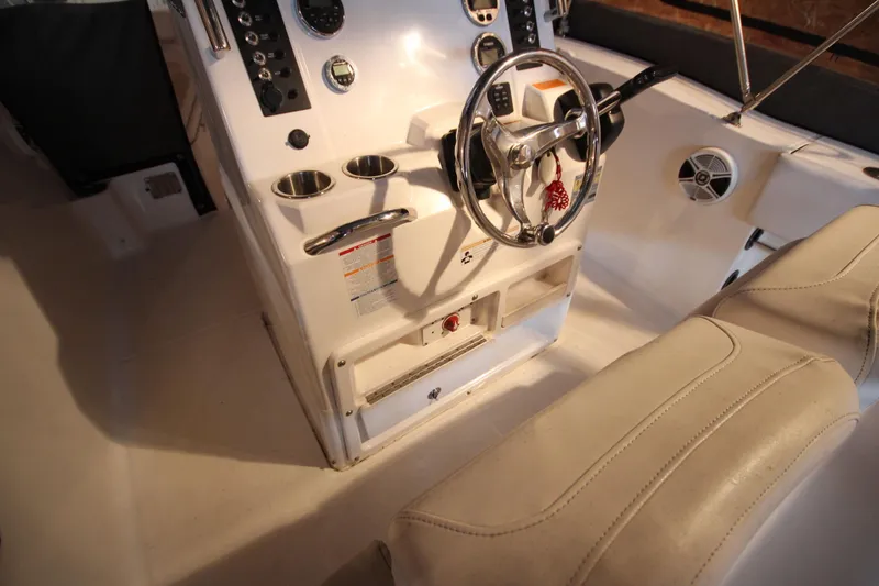 Slide: The Image of 2016 Robalo R200 Center Console boat interior with steering wheel and controls. - 19