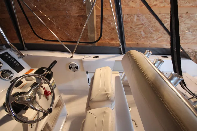 Slide: The Image of 2016 Robalo R200 Center Console boat interior with steering wheel and seating. - 20